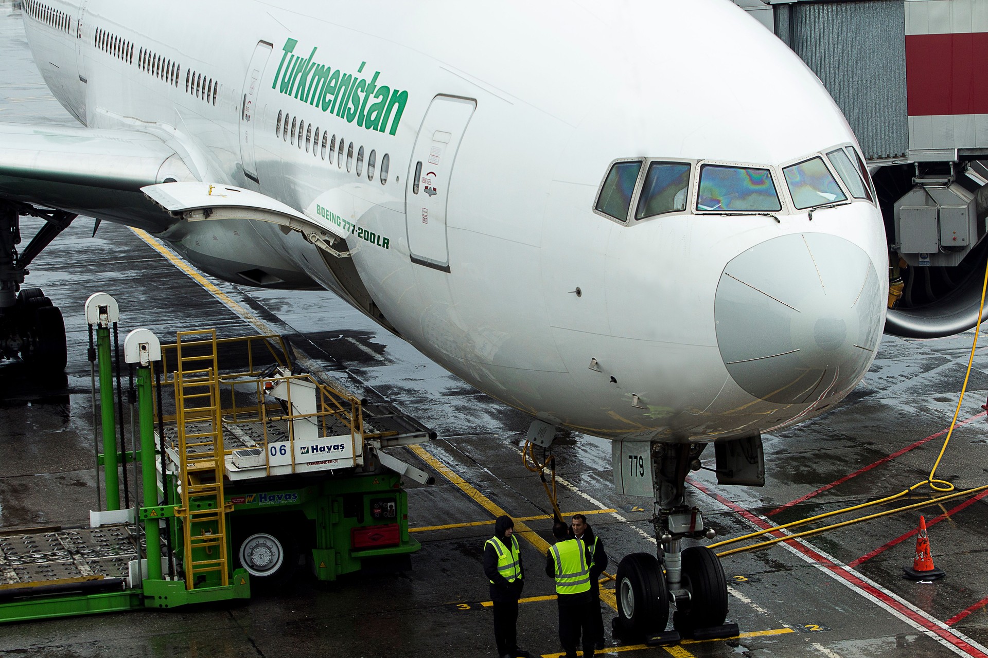 A Turkmenistan Airlines Boeing 777-200LR is waiting for its passengers at Ataturk Istanbul Airport, Turkey, at 28th of November, 2018, while being serviced by Havas Ground Services.