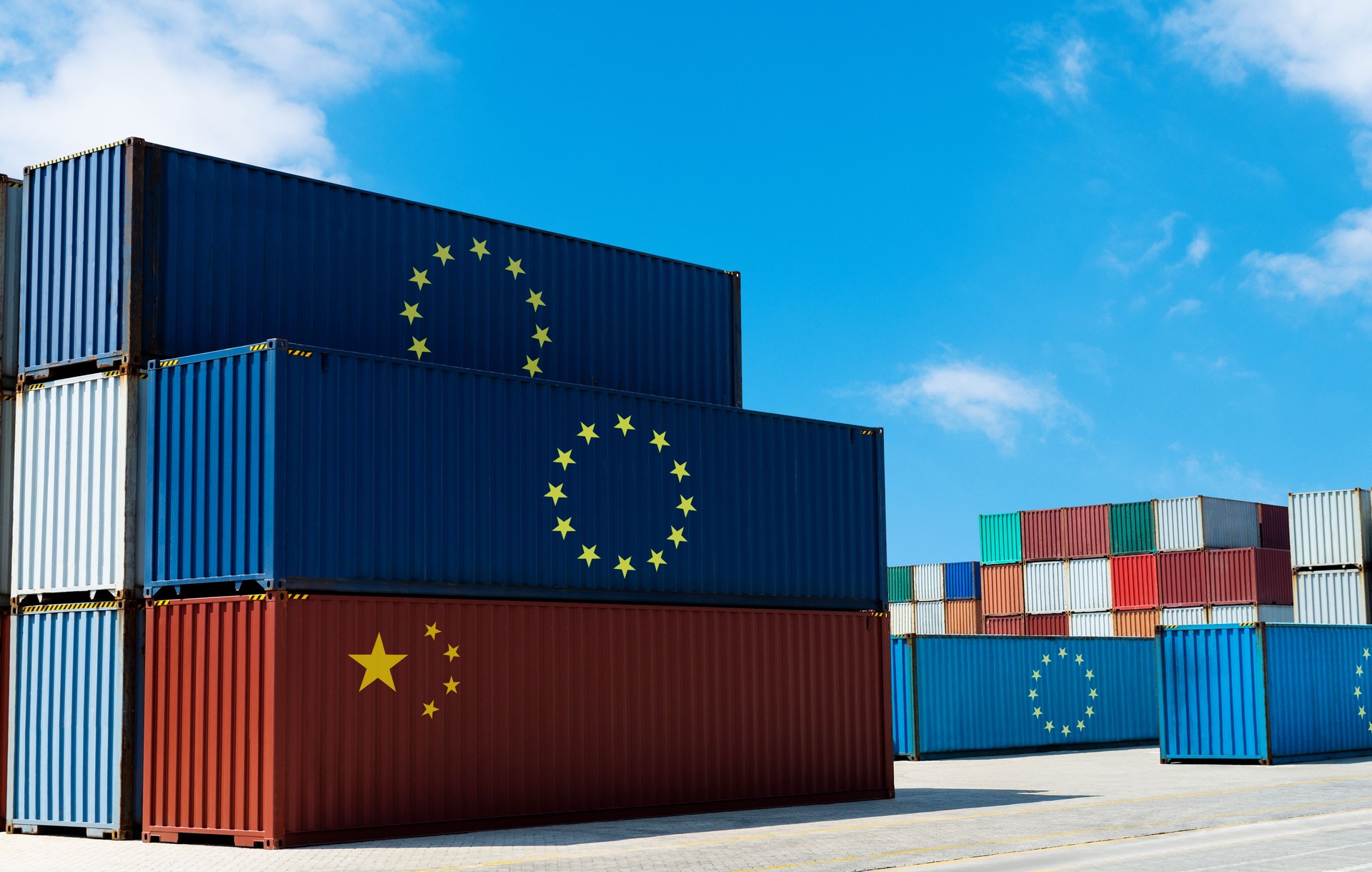 Large group of cargo containers with European Union flag and Chinese flag at the docks